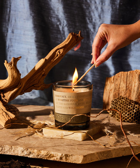 gorgeous candle on driftwood table